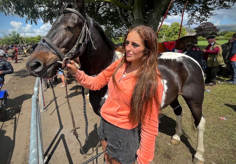 Lucy Smith, a young Traveller from Morecambe, with her horse Comanche at the Flashing Lane at the Appleby Horse Fair. Photograph: Mark Paul