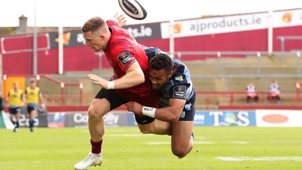 Andrew Conway is tackled by Willis Halaholo. Photograph: Billy Stickland/Inpho