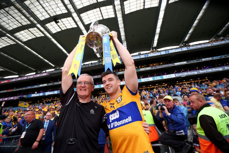 Clare manager Brian Lohan and captain Tony Kelly celebrate with the Liam MacCarthy Cup. Photograph: Ryan Byrne/Inpho