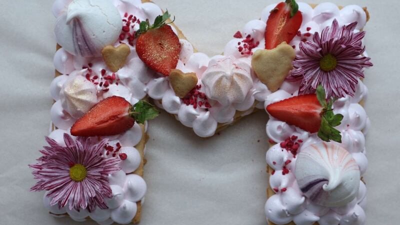 A shortbread celebration cake decorated with meringues, marshmallows, fruit and flowers  from Delish Melish