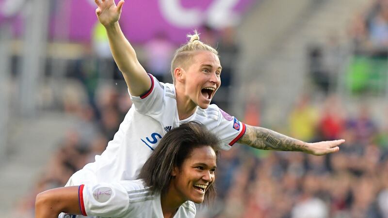 Lyon’s Welsh midfielder Jess Fishlock celebrates with  French defender Wendie Renard after their victory over Barcelona in the Women’s Champions League final  in Budapest. Photograph: Tobias Schwarz/AFP/Getty Images