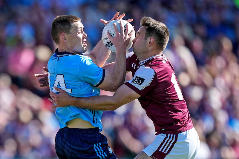 Con O`Callaghan of Dublin is challenged by Cillian McDaid of Galway. Photograph: James Lawlor/Inpho
