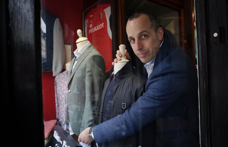 “Of my sales last year, 80 per cent were occasion-driven.” - Paddy Sheary adjusts the display in his menswear shop on Clarendon Street in Dublin. Photograph : Laura Hutton