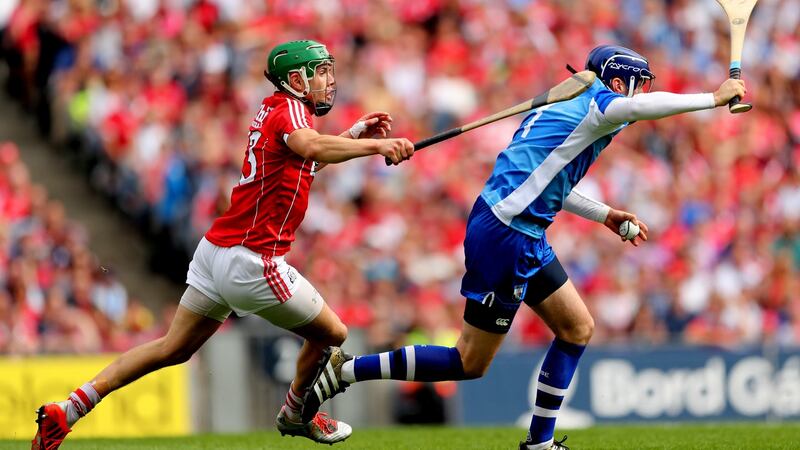 Stephen O’Keeffe evades Cork’s Alan Cadogan. Photograph: James Crombie/Inpho