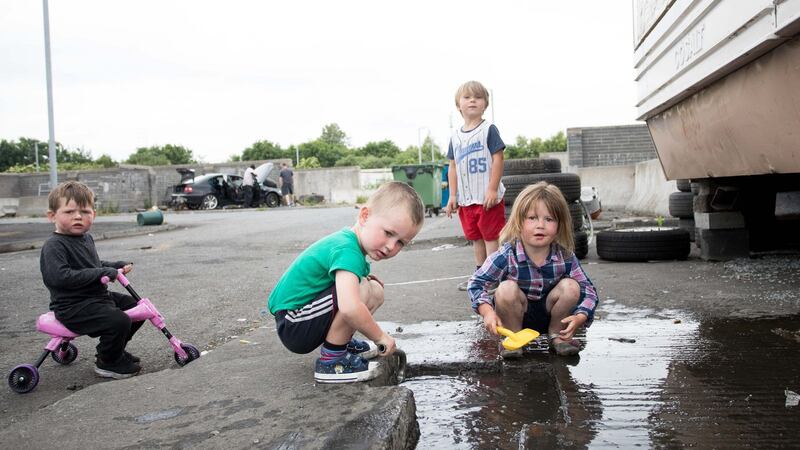 Declan Jnr Ward, Thomas Ward, Tom Ward and Demelia Ward  playing at St Mary’s Halting Site, Cappagh Road, Finglas, Dublin. Photograph: Tom Honan