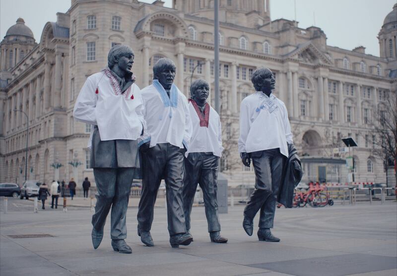 The Beatles statues at Pier Head in Liverpool dressed in traditional Ukrainian clothing ahead of Eurovision. Photograph: BBC Studios