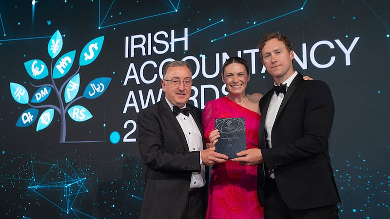 John Gaynor, awards judging coordinator, presents the finance team of the year – large award to Anna Savage and Ross Brosnan, Fexco