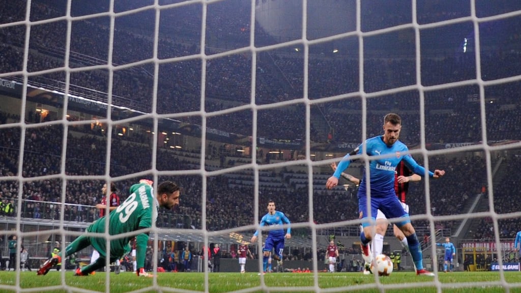 Aaron Ramsey scores Arsenal’s second goal in the Europa League round of 16 first leg against AC Milan at the San Siro stadium. Photograph: Alberto Lingria/Reuters