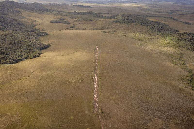 An abandoned landing strip used by illegal miners in the Yanomami Indigenous territory of Brazi. Photograph: Victor Moriyama/The New York Times
                      