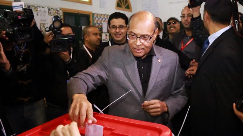 Tunisian president Moncef Marzouki casts his ballot paper at a polling station in Sousse, Tunisia, 21st December 2014. Photograph: EPA/STR