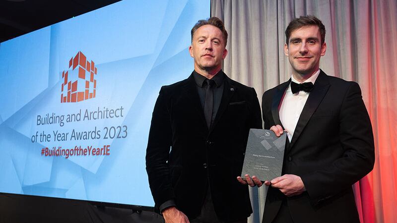 Aaron O'Grady, founder, Vision Creative Studios, presents the rising star in architecture award to Cormac McAteer, White Ink Architects