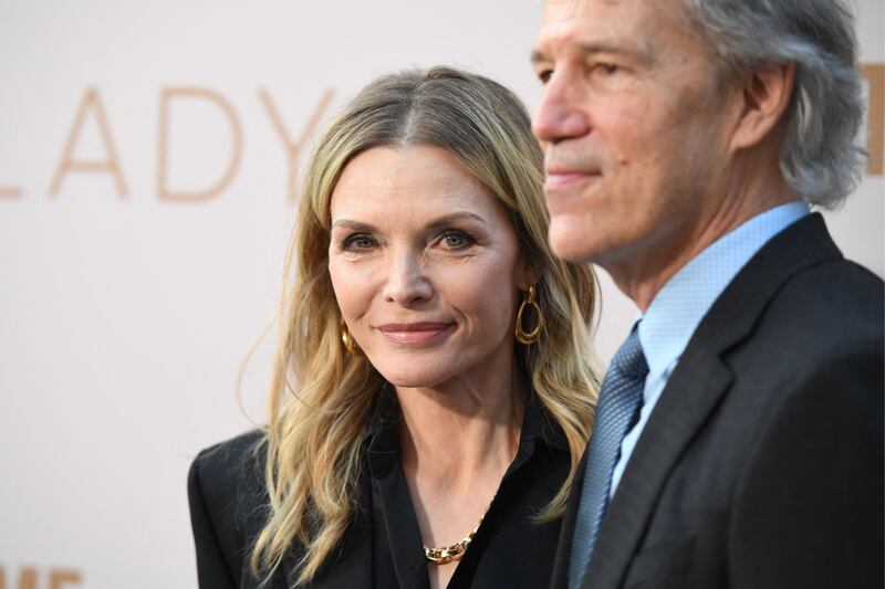 Michelle Pfeiffer and husband David E Kelley. Photograph: Robyn Beck/AFP via Getty Images