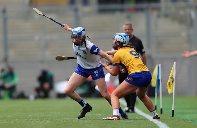 Clare’s Aoife Anderson tackles Waterford's Mairead O’Brien. Photograph: Leah Scholes/Inpho