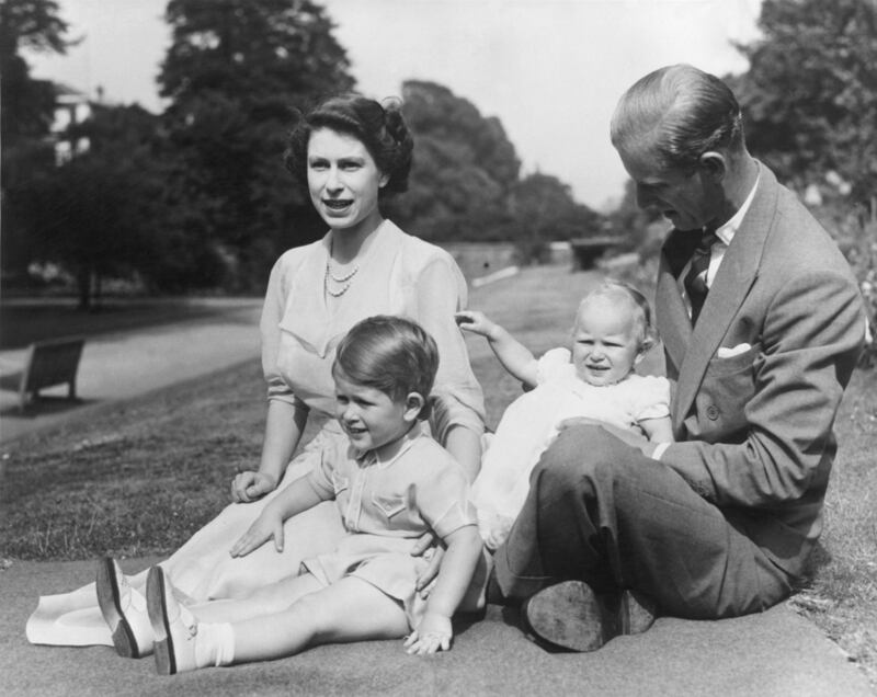 Princess Elizabeth and Prince Philip in 1951 with their two children, Prince Charles and Princess Anne in the grounds of Clarence House, London.  Photograph: Fox Photos/Getty Images