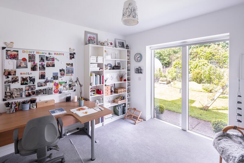 The fifth bedroom is laid out as a home office.