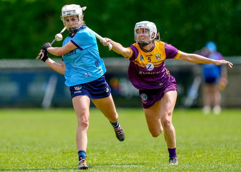 Grace O`Shea of Dublin with Wexford's Amy Cardiff Wexford during the clash at Parnell Park. Photograph: James Lawler/Inpho