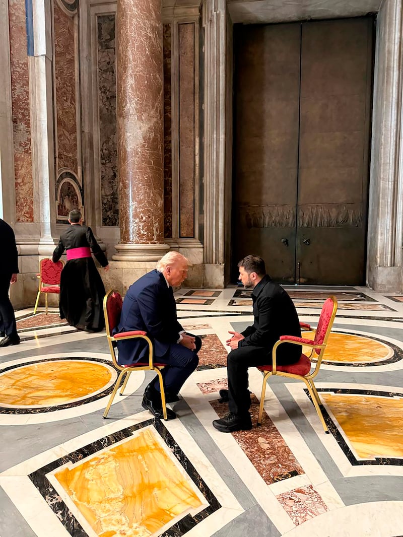 Ukrainian President Volodymyr Zelenskiy and US President Donald Trump talk as they attend the funeral of Pope Francis in the Vatican (Ukrainian Presidential Press Office via AP)