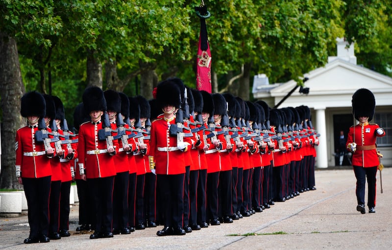 Members of the Coldstream Guards leave Wellington Barracks, central London, ahead of the ceremonial procession of the coffin of Queen Elizabeth II from Buckingham Palace to Westminster Hall./ Photograph: PA Wire