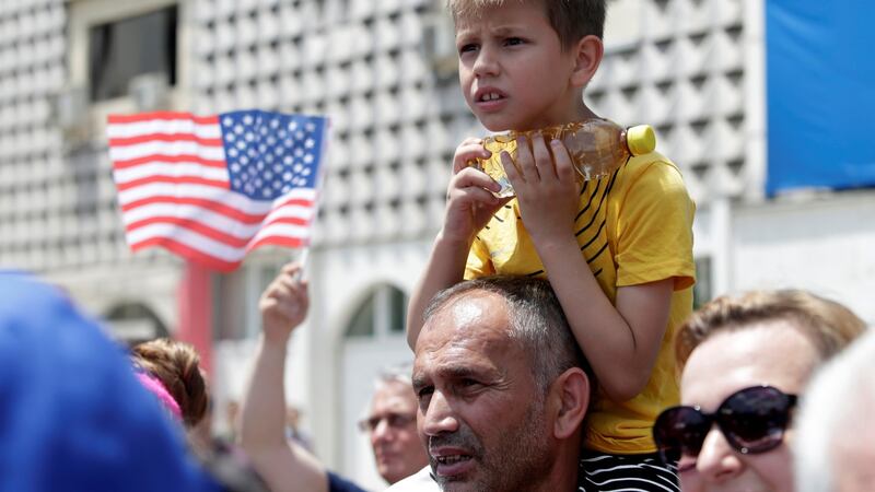 A boy looks on during the 20th anniversary of the deployment of Nato Troops in Kosovo, in Pristina on  Thursday. Photograph:  Florion Goga/Reuters