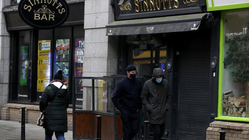 People walk past Sinnotts pub in Dublin's city centre as the High Court has ruled that four pubs owners are entitled to compensation from insurer FBD over losses suffered because of Covid-19. The landmark ruling is likely to have an impact on the hundreds of claims taken by pubs and restaurants across the country. Picture date: Friday February 5, 2021. PA Photo. See PA story IRISH Coronavirus Insurance. Photo credit should read: Brian Lawless/PA Wire People walk past Sinnotts pub in Dublin's city centre as the High Court has ruled that four pubs owners are entitled to compensation from insurer FBD over losses suffered because of Covid-19. The landmark ruling is likely to have an impact on the hundreds of claims taken by pubs and restaurants across the country. Picture date: Friday February 5, 2021. PA Photo. See PA story IRISH Coronavirus Insurance. Photo credit should read: Brian Lawless/PA Wire