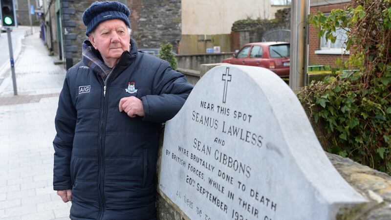 Jimmy Lawless, grandson of Séamus Lawless who was murdered by the Black and Tans in January 1920,  at the spot he was killed on Bridge Street, Balbriggan. Photograph: Dara Mac Dónaill/The Irish Times