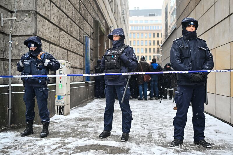 Police officers block the entrances to the Television Information Agency after Poland's new minister for cultures dismissed the heads of the state television channel and Polish Radio. Photograph: Omar Marques/Getty Images