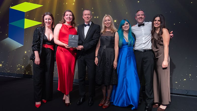 JP Rust, managing director at SIG Workplace, presents the fit out project of the year - large office (under €7.5 million) award to the RKD Architects team