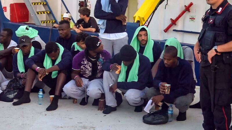A screengrab  from  video  shows migrants disembarking from the Sea-Watch 3 charity ship at the Italian island port of Lampedusa. Photograph: Anaelle Le Bouedec/AFP/Getty