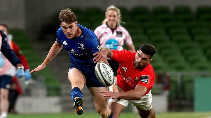 Garry Ringrose kicks ahead under the challenge of Damian de Allende. Photograph: Bryan Keane/Inpho