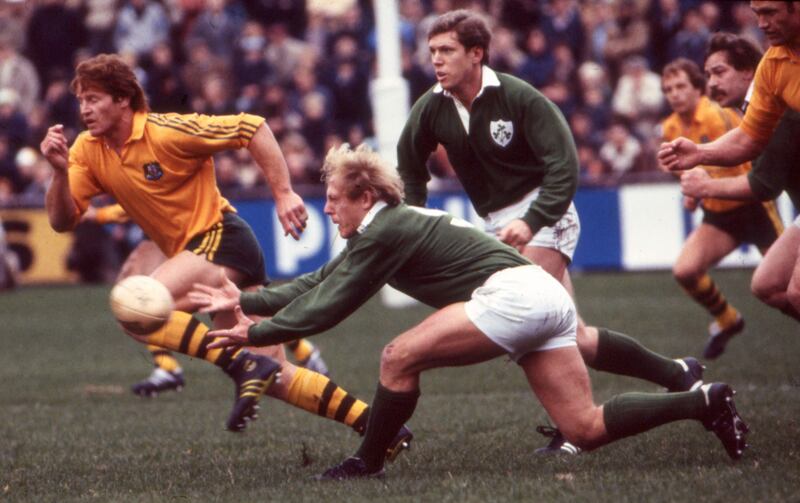 Ireland’s Robbie McGrath supported by Fergus Slattery and Phil Orr during the Autumn International against Australia in November 1981 at Lansdowne Road. Photograph: Billy Stickland/Inpho


