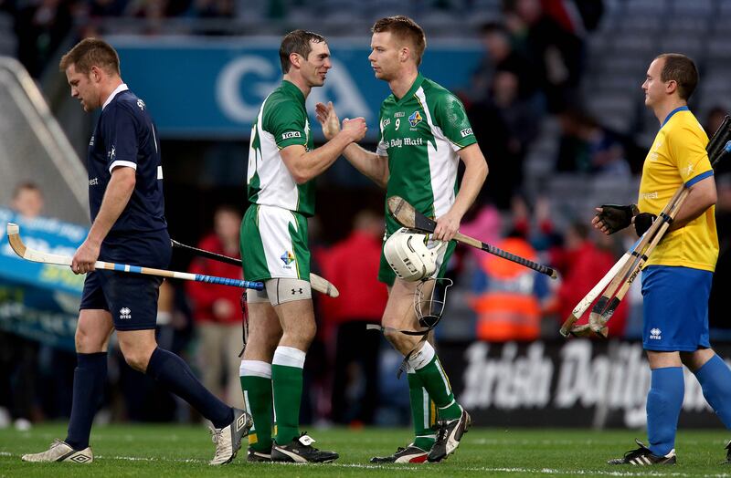 Ireland's Neil McManus and Jack Kavanagh celebrate winning a hurling-shinty international in 2013. Photograph: Ryan Byrne/Inpho