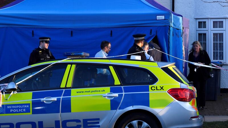Police officers at a forensic tent erected outside the home of Nikolay Glushkov in New Malden, on the outskirts of London, on Friday. Photograph: Toby Melville/Reuters