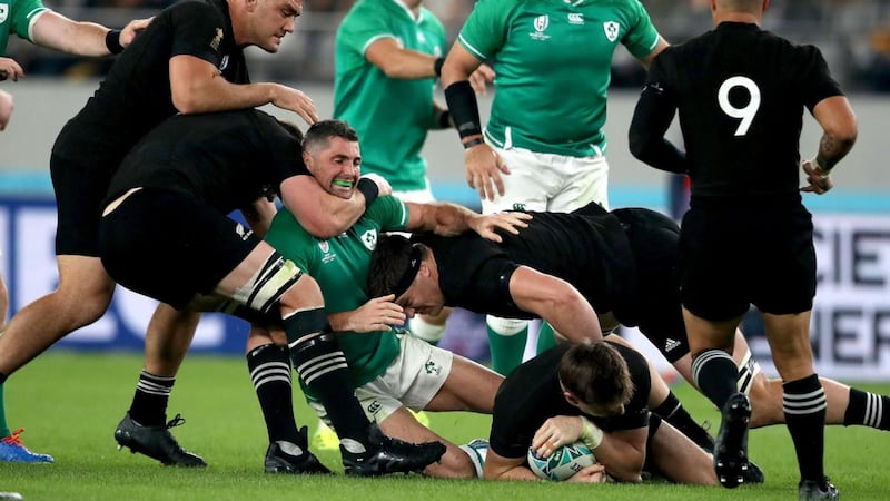 Ireland’s Rob Kearney is tackled by New Zealand’s Kieran Read. Photograph: Dan Sheridan/Inpho