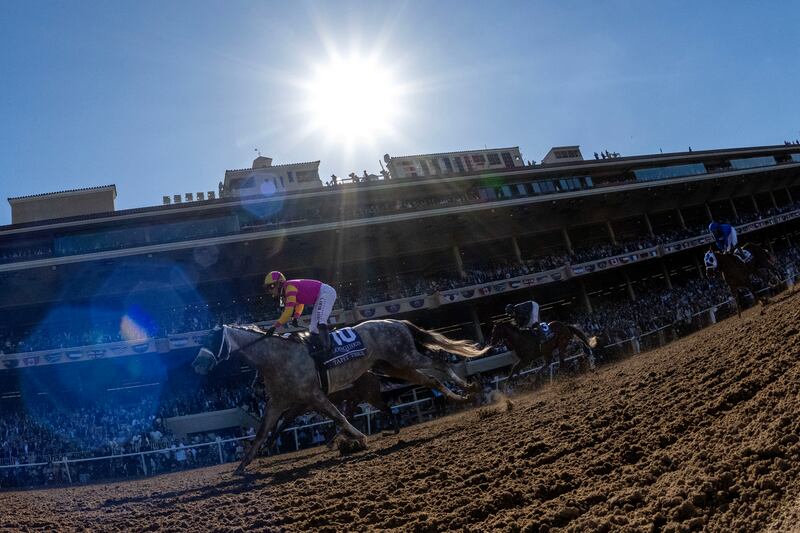 Tapit Trice, ridden by Irad Ortiz Jr, leads City of Troy, ridden by  Ryan Moore, down the front stretch in the Breeders' Cup Classic in Del Mar, California. Photograph: Donald Miralle/Getty Images