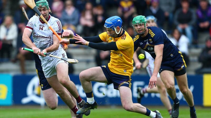 Galway’s Brian Concannon shoots past Wexford’s Mark Fanning to score a goal during the Leinster SHC match at  Chadwicks Wexford Park. Photograph: Ken Sutton/Inpho