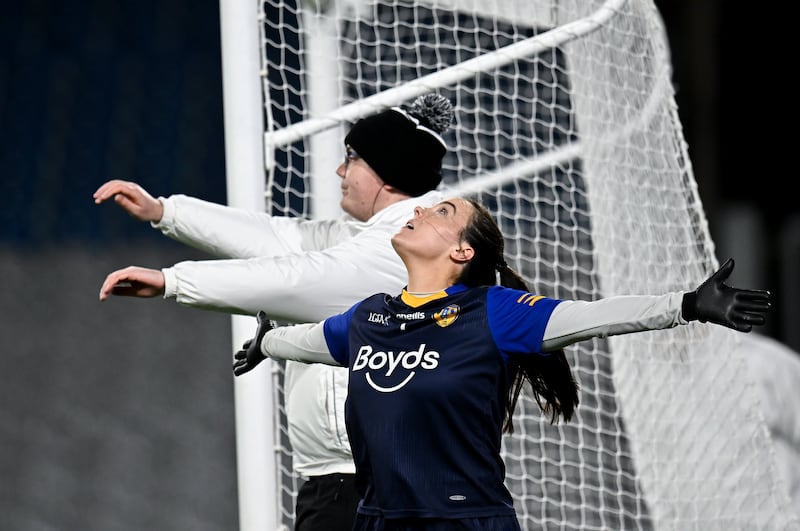 St Ergnat's goalkeeper Áine Devlin and umpire Aaron Douglas wave a shot wide during the final. Photograph: Piaras Ó Mídheach/Sportsfile