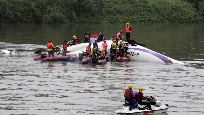Rescuers rushed to the scene of the TransAsia Airways plane crash  in New Taipei City. Photograph: Pichi Chuang/Reuters