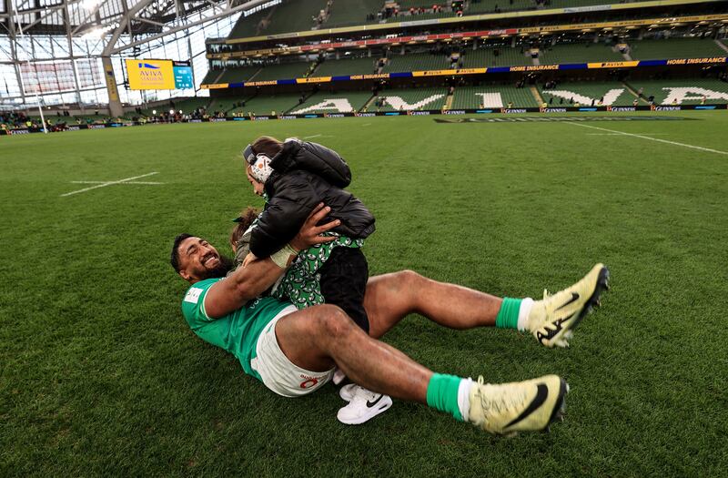 Ireland’s Bundee Aki celebrates with his children after the game. Photograph: Dan Sheridan/Inpho