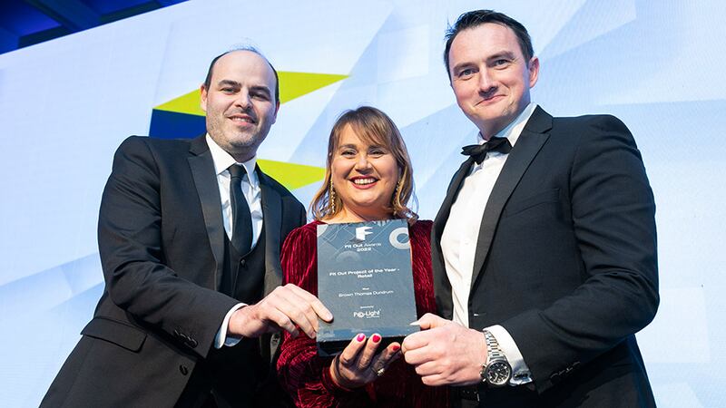 Catherine Lambe, business support manager, Pro-Light, presents the Fit Out Project of the Year – Retail award to Fintan Morgan, Buildcost, and  Dave Merriman, T&I Fitouts.