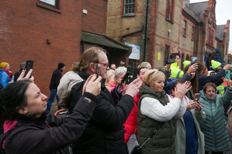 People applaud as the hearse passes. Photograph: EPA-EFE
