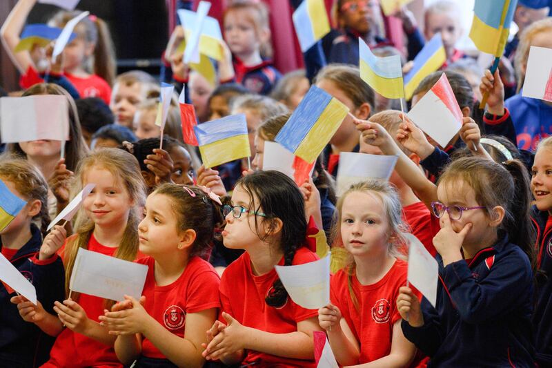 Children cheered with Ukrainian flags during the cultural exchange concert at St Vincent's Convent Primary School, Blackpool, Cork. Photograph: David Jones
