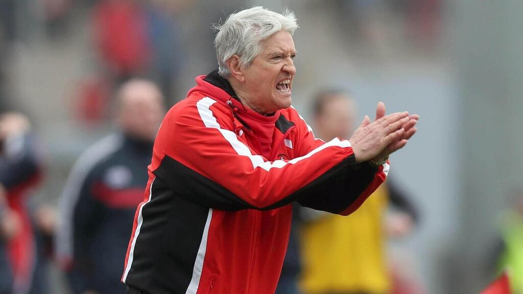 Derry manager Brian McIver urges on his side at Páirc Uí Rinn. Photograph: InphoDonall Farmer