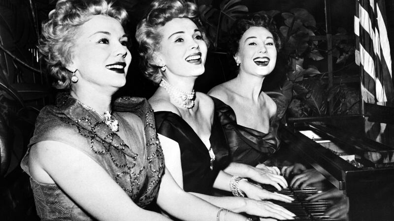 January 1954 shows US actress Zsa Zsa Gabor (centre) and her sisters Eva (left) and Magda, playing piano on  new year’s day, 1954. Photograph: AFP/Getty Images