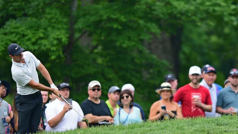 Rory McIlroy plays his shot from the rough on the seventh hole during the final round of the Memorial golf tournament. Photo: David Dermer/AP Photo