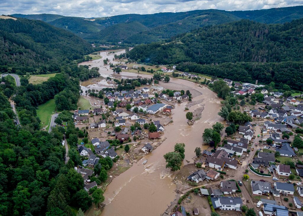 The Ahr river floats past destroyed houses in Insul, Germany, July 2020. Photograph: AP