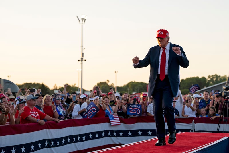 Donald Trump dances as he takes to the stage in Des Moines, Iowa. Photograph: Haiyun Jiang/The New York Times
                      