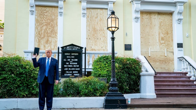 Donald Trump holds a Bible outside St John’s Church in Washington on Monday after authorities used tear gas to disrupt peaceful protests outside the White House to clear a path for the US president. Photograph: Doug Mills/The New York Times.