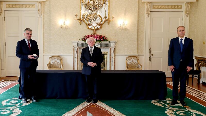President Michael D Higgins presents the Minister for the Wesht Dara Calleary with his seal of office  at Áras an Uachtaráin. Photograph: Maxwells