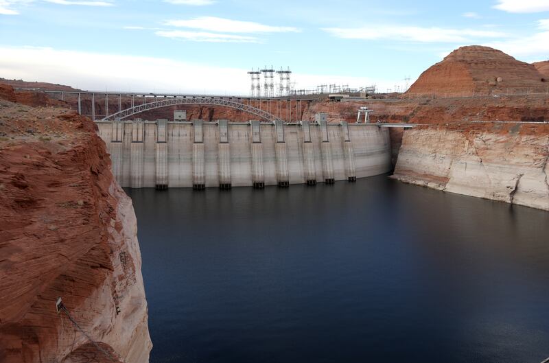 Electrical transmission towers stand near the Glen Canyon Dam at Lake Powell in Page, Arizona. Photograph: Justin Sullivan/Getty Images