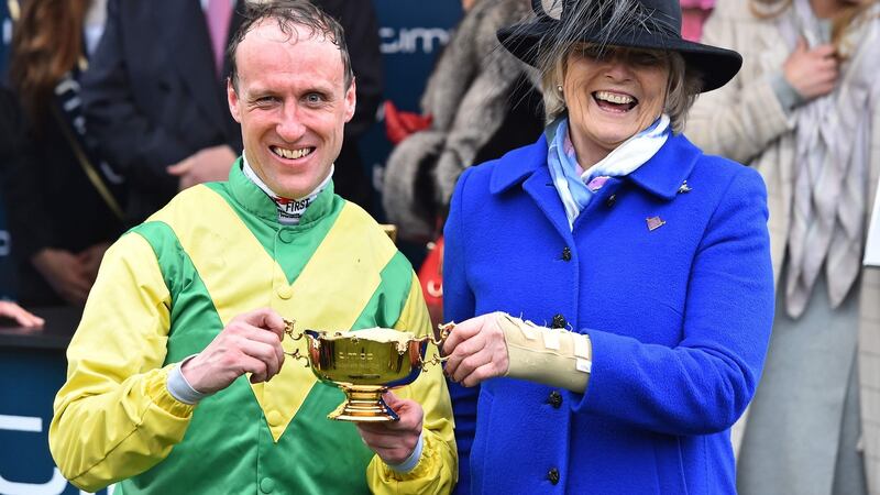 Jockey Robbie Power and  trainer Jessica Harrington celebrate after winning the Gold Cup with their runner Sizing John. Photograph: Glyn Kirk/AFP/Getty Images